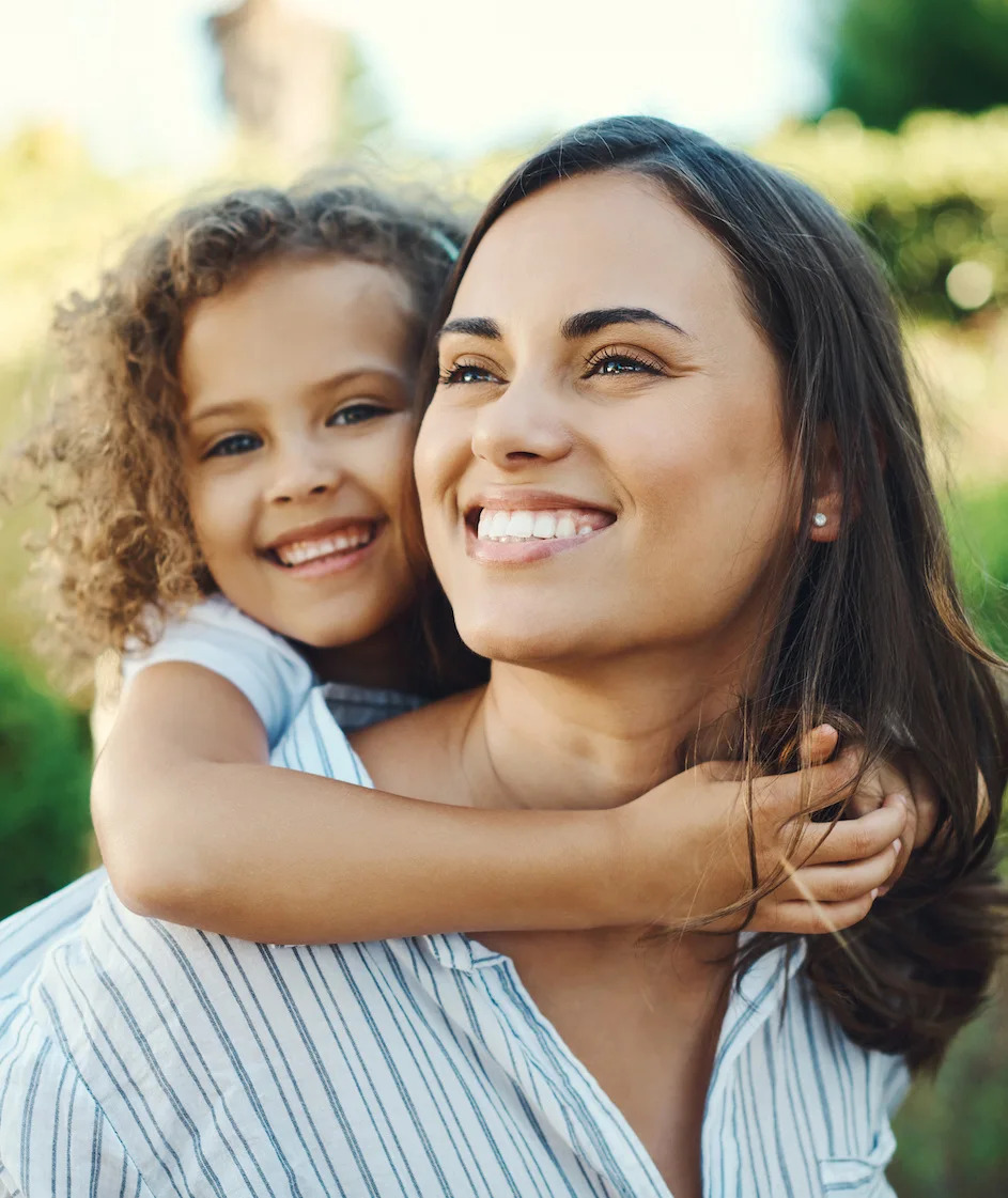 beautiful mom and daughter smiling